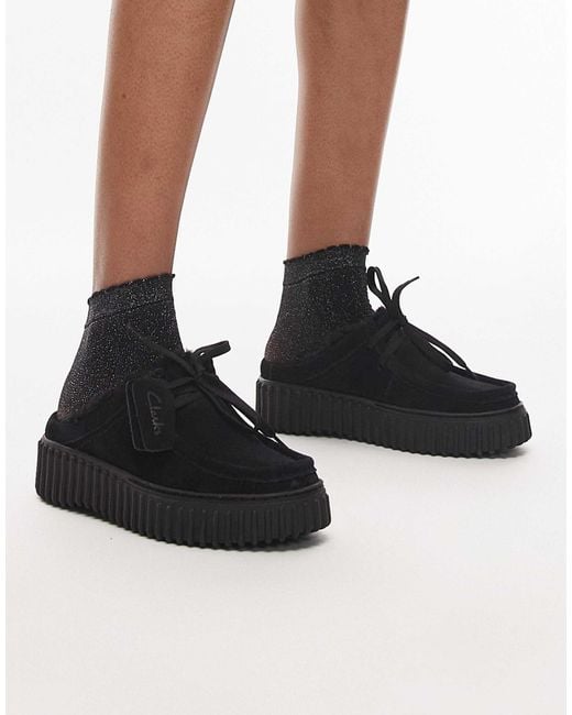 Clarks Black – torhill – mules mit futter aus teddyfell