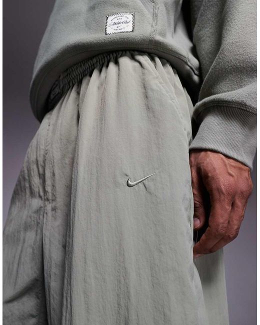 Nike Gray Athletic Club Badge Logo Track Pants for men
