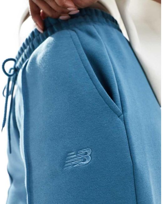 New Balance Fleece Broek Met Wijde Pijpen in het Blue