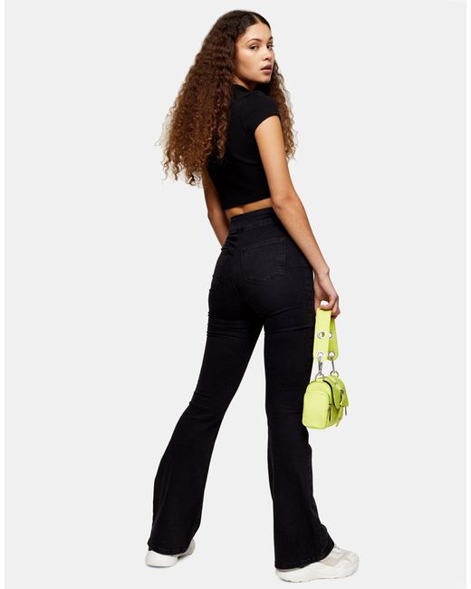 TOPSHOP Skinny Stretch Flare Jeans in Black | Lyst