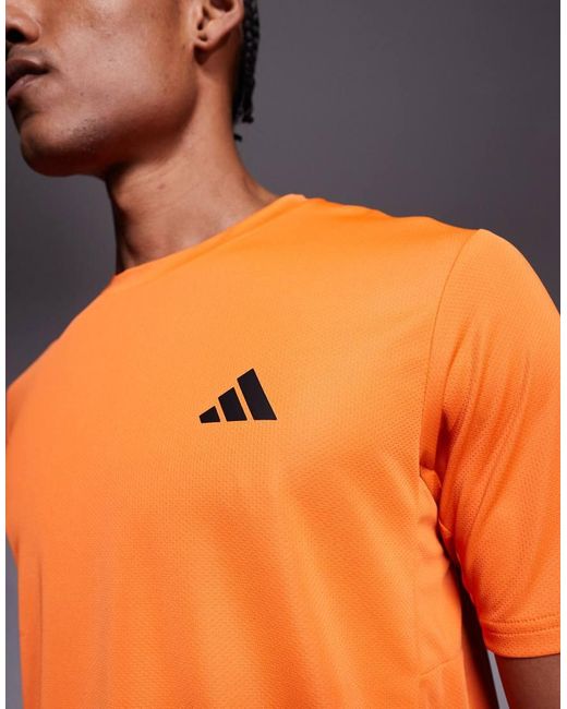 Adidas Originals Orange Adidas Training Essentials T-Shirt for men