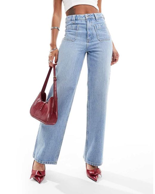 Jeans A Fondo Ampio Medio Con Tasche Applicate di New Look in Blue