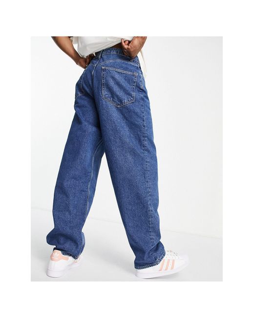 Jeans ultra ampi lavaggio medioASOS in Denim da Uomo colore Blu | Lyst