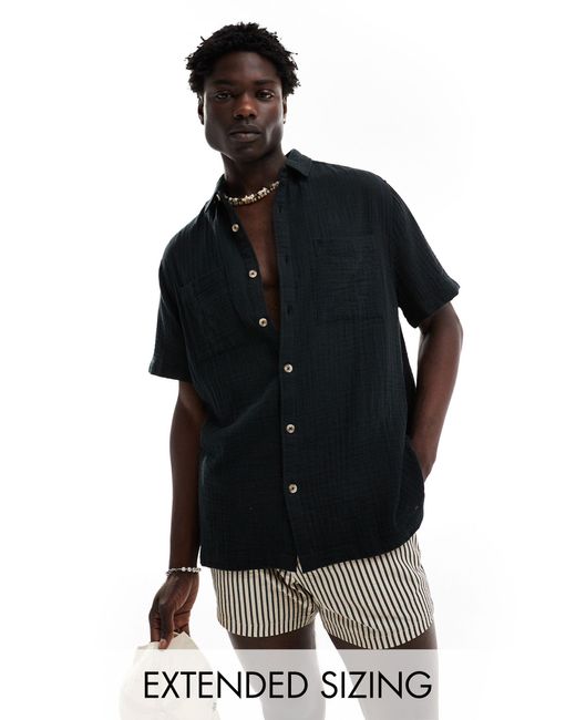 Chemise décontractée texturée avec manches courtes et col à revers ASOS pour homme en coloris Black