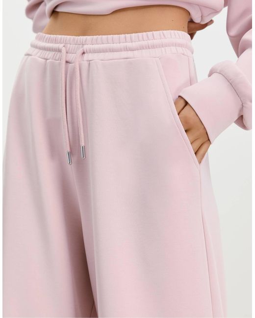 Pantalon palazzo doux - bubblegum Stradivarius en coloris Pink
