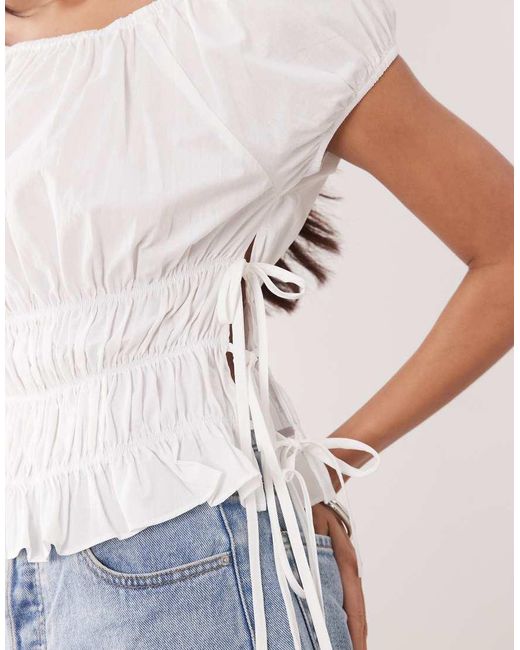 The Frolic White Exclusive Cotton Shirred Tie Side Detail Top