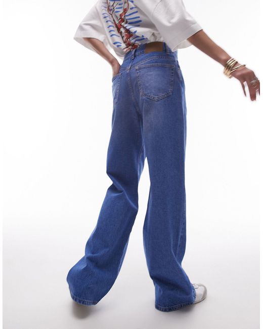 Jeans a colonna a vita medio alta medio acceso di TOPSHOP in Blue