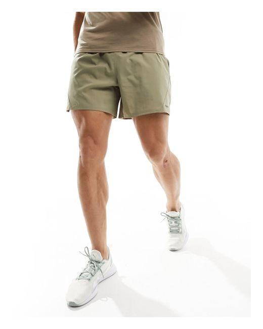 Training - evolve - pantaloncini beige di PUMA in Green da Uomo