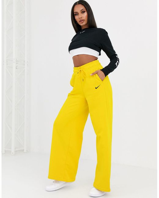 Nike Yellow – Gelbe Jogginghose mit hoher Taille und weiten Hosenbeinen