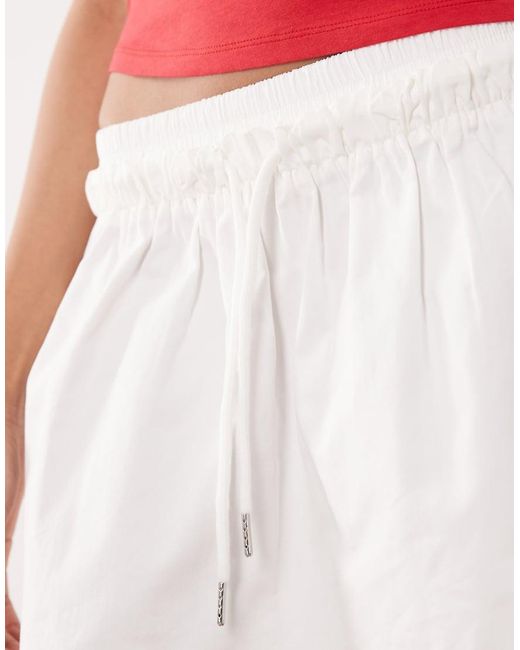 The Frolic Red Exclusive Ruffle Waist Poplin Micro Skort