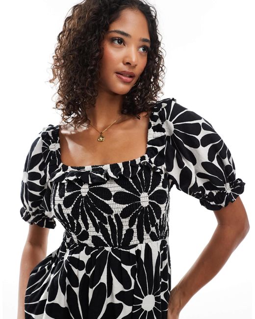 Robe tendance folk à manches bouffantes et imprimé fleuri - noir New Look en coloris Black