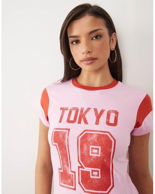 ASOS Pink Patchwork Sleeve Baby Tee With Varsity Tokyo Graphic