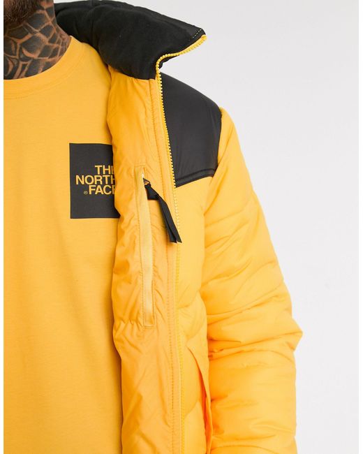 the north face saikuru puffer jacket in yellow