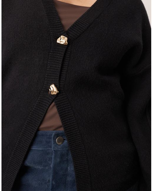 ARRANGE Black Curve Sculpted Waist Cardigan With Ovoid Sleeve