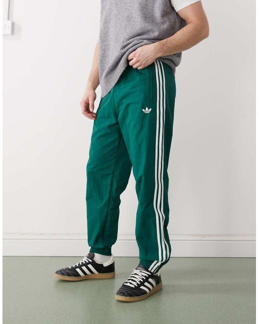 Adidas Originals Green Firebird Woven Track Pants for men
