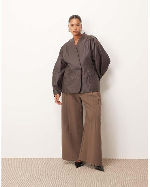 ARRANGE Brown Curve Soft Leather Jacket With Cinched Waist And Ovoid Sleeve