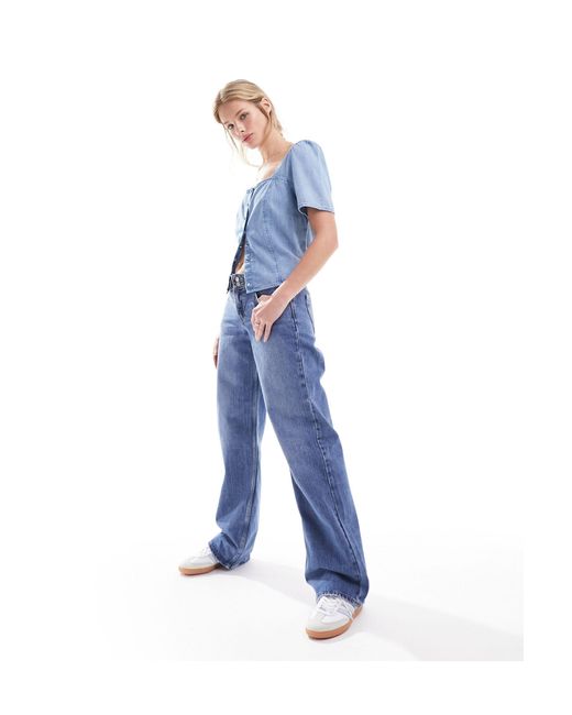 Jean ample à taille ultra-basse - moyen délavé Levi's en coloris Blue