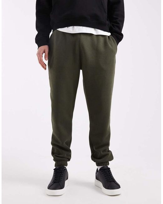 Joggers Verdes Básicos De Corte Tapered Essentials De ASOS de hombre de color Black