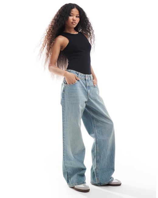 Asos design petite - jean baggy à taille basse - pâle vintage ASOS en coloris Blue