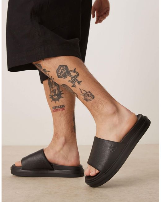 Calvin Klein Black Embossed Slider Sandals for men