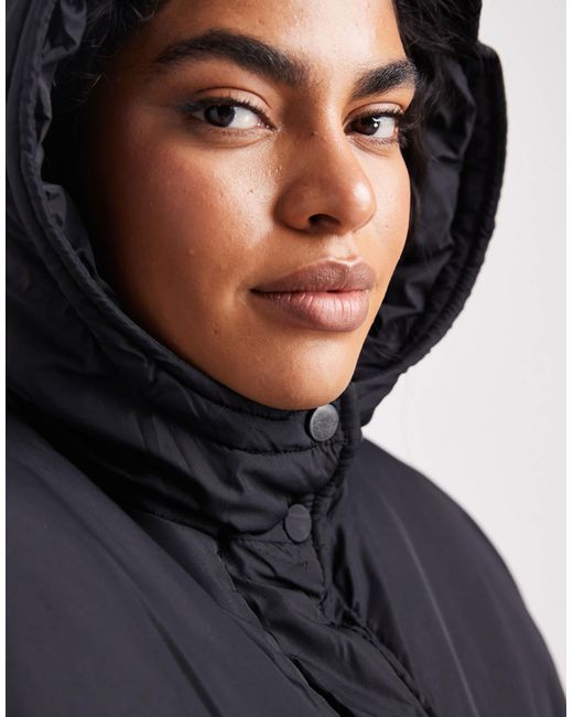 Doudoune longue à capuche Threadbare Plus en coloris Black