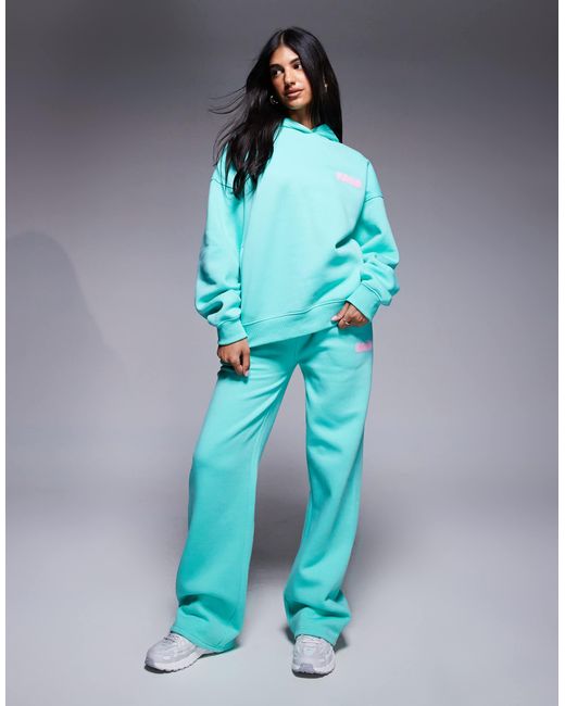 Sweat à capuche oversize d'ensemble en coton mélangé avec logo imprimé en relief - turquoise et rose pastel Kaiia en coloris Blue