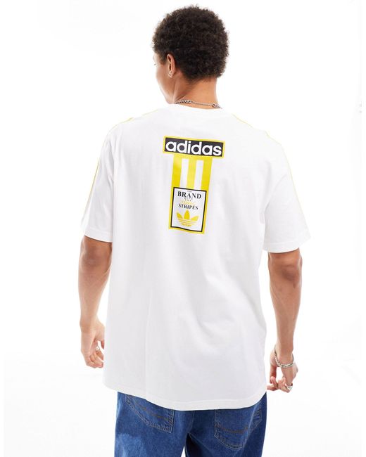 Camiseta blanca con logo amarillo Adidas Originals de hombre de color White