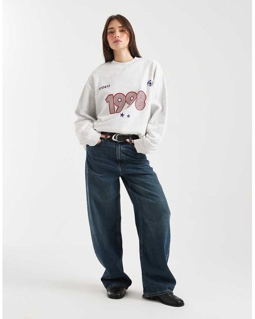 ASOS White Oversized Sweatshirt With 1998 Sports Graphic
