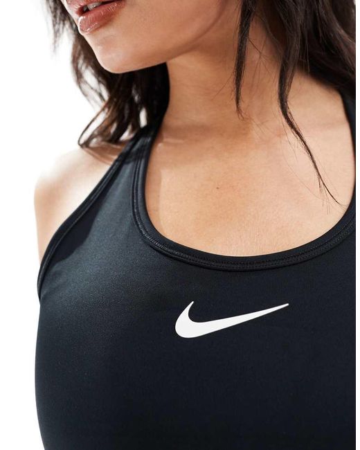 Reggiseno Sportivo A Sostegno Medio Con Logo Nike di Nike in Black