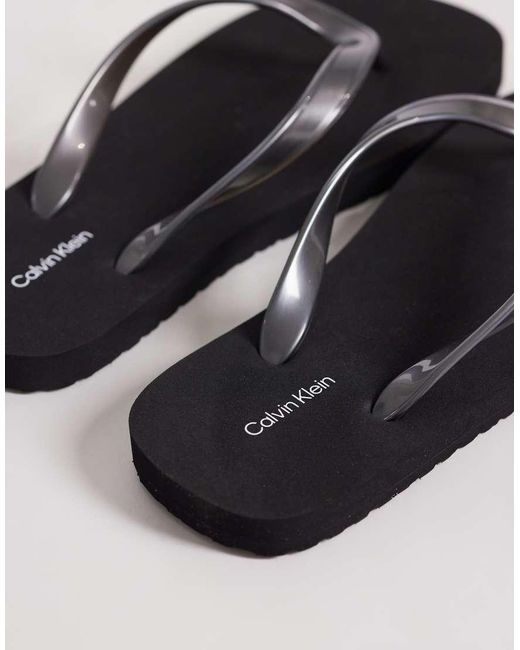 Calvin Klein Black Jeans Metallic Flip Flops