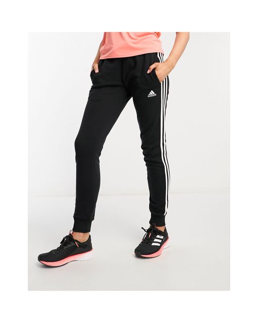 adidas Originals Adidas Sportswear Essentials 3 Stripes joggers in Black |  Lyst UK