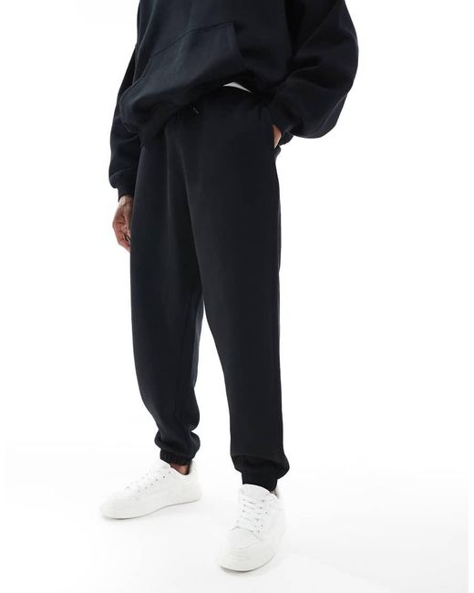 Joggers Negros Holgados Básicos Essentials De ASOS de hombre de color Blue