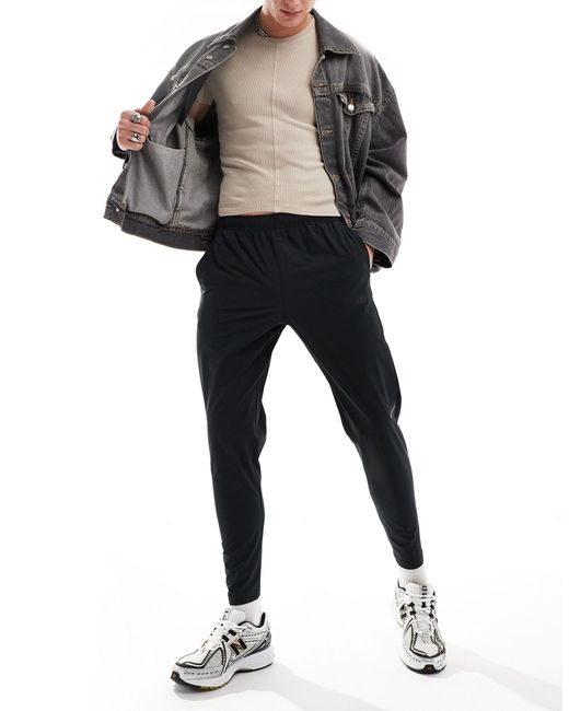 New Balance Black Tenacity Stretch Woven Pant for men