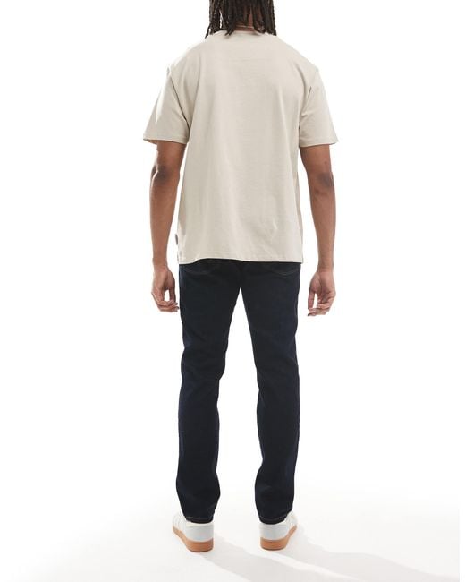 Wrangler – larston – schmale karottenjeans in White für Herren