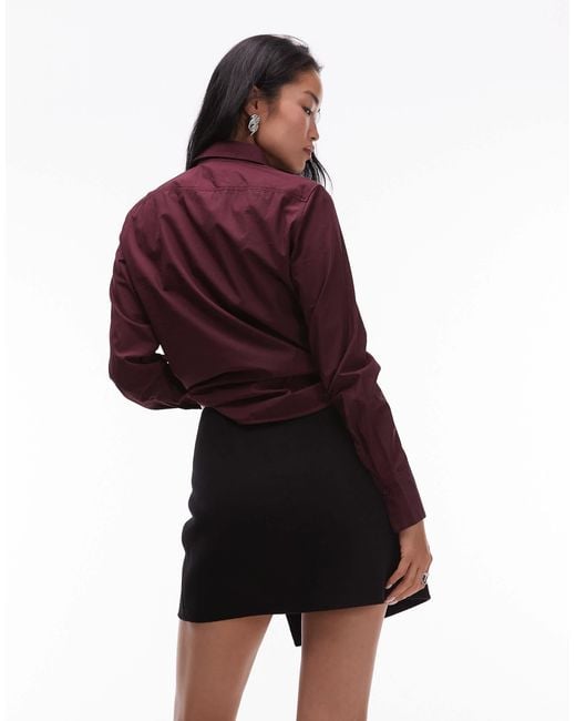 Mini-jupe en laine duveteuse à détail boutonné effet portefeuille sur le devant ARKET en coloris Red