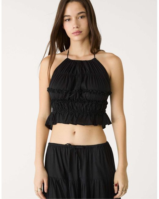 Top dos nu à dos ouvert Stradivarius en coloris Black