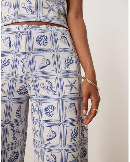 Pantalon d'ensemble ample à imprimé coquillages - bleu ASOS en coloris Natural