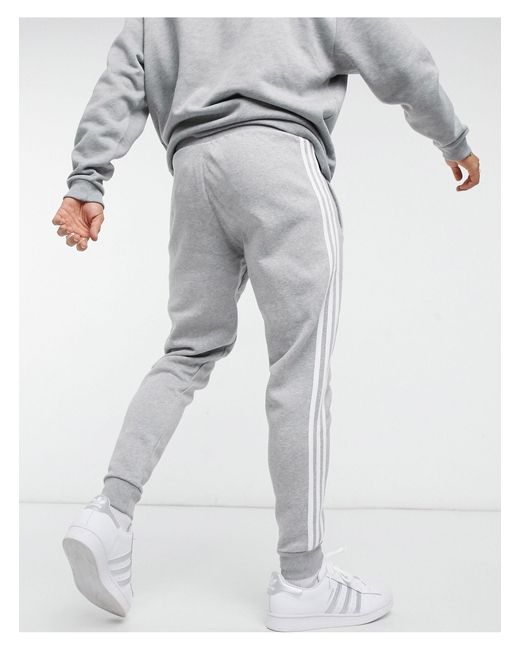 adidas Originals – adicolor – eng geschnittene jogginghose mit den drei  streifen in Grau für Herren - Lyst