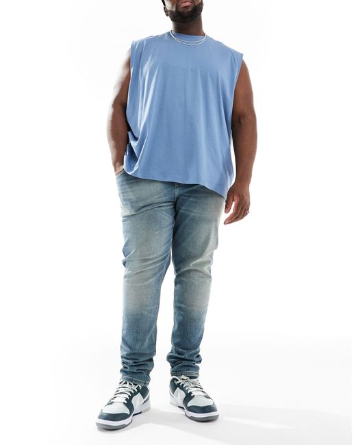 Jean skinny - délavé moyen ASOS pour homme en coloris Blue