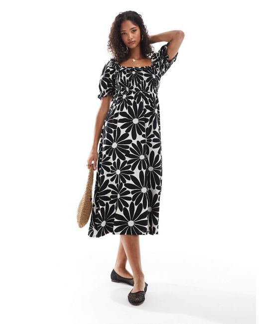 Robe tendance folk à manches bouffantes et imprimé fleuri - noir New Look en coloris Black