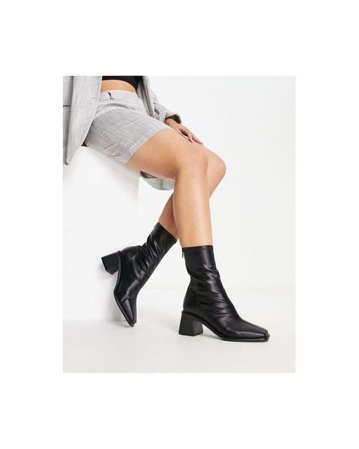 Mid block heel store sock boots