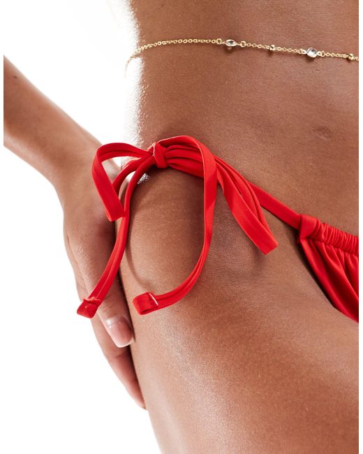Maya - slip bikini rossi mix and match con allacciatura laterale di ASOS in Red