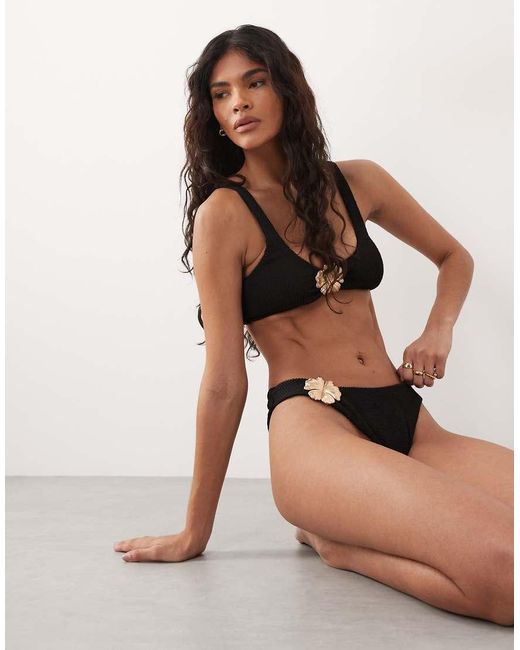 The Frolic Black Exclusive Crinkle Metal Flower Trim High Leg Brazilian Bikini Bottom