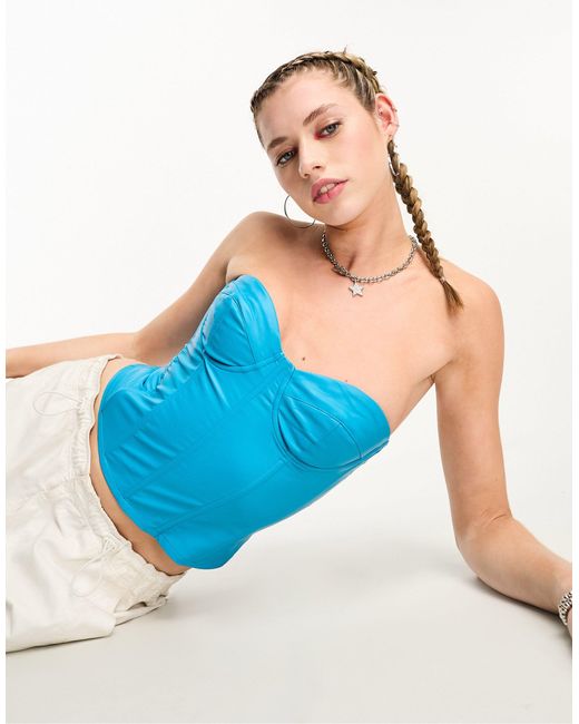 Crop top style corset sans bretelles en imitation cuir Edikted en coloris  Bleu | Lyst