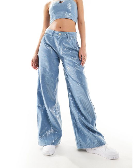 Jeans a vita medio alta ampi con paillettes di Liquor N Poker in Blue