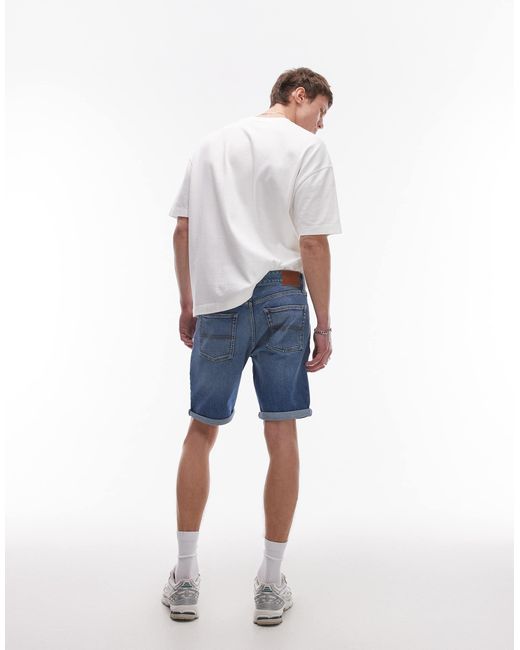 Scanton - short en jean coupe slim à revers - délavage moyen Tommy Hilfiger pour homme en coloris Blue