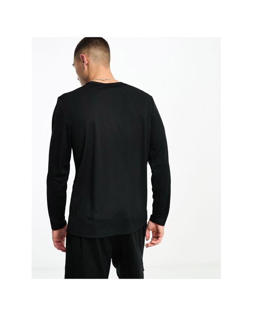 Miler dri-fit - t-shirt a maniche lunghe nera di Nike in Black da Uomo