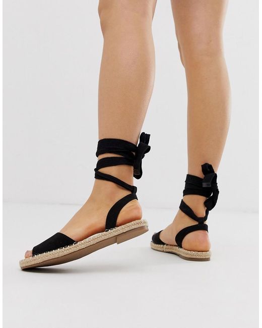 Truffle Collection Tie Leg Espadrille Flat Sandals in Black | Lyst