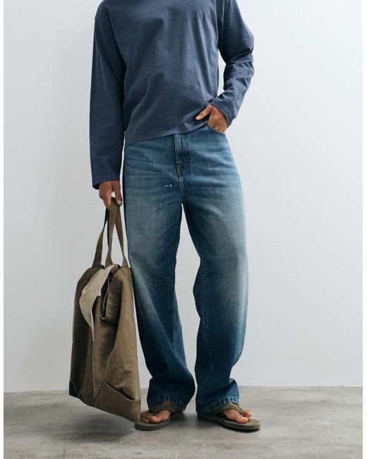 Carhartt Blue Landon Loose Fit Tapered Jeans With Paint Splatter Detail for men