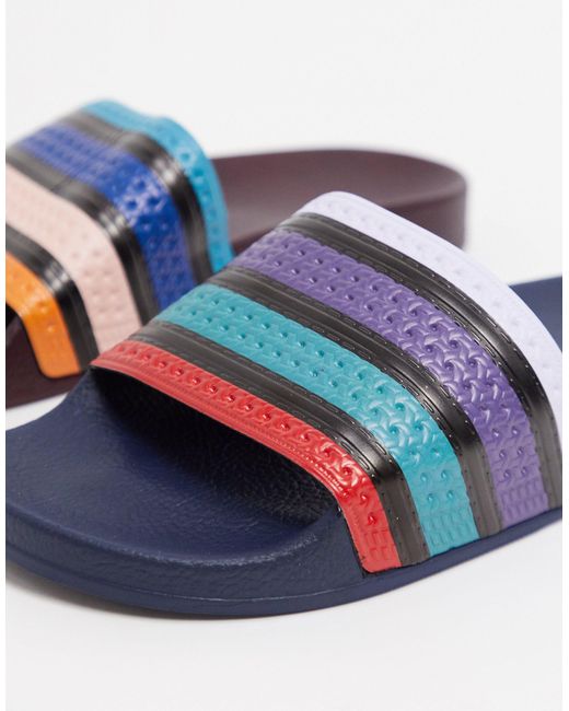 adidas Originals Adilette - Verschillende Slippers Met Gekleurde Strepen in  het Blauw voor heren | Lyst NL